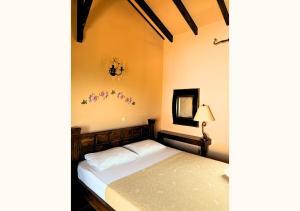 a bedroom with a bed and a mirror at INSPIRA THASSOS APARTMENTS and STUDIOS in Skala Sotiros