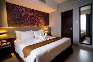 Postel nebo postele na pokoji v ubytování Hotel De Grand Villa By IGI Airport