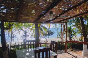 a view of the beach from the porch of a beach house at chez Leo in Tuléar