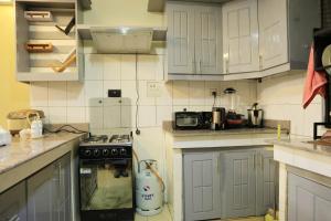 Köök või kööginurk majutusasutuses AG Home - Kampala
