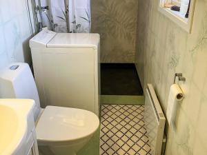 a small bathroom with a toilet and a sink at 6 person holiday home in SUNNE-By Traum in Sunne