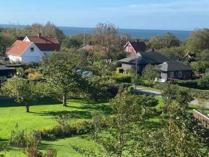 a view of a village with houses and trees at 5 star holiday home in STENINGE in Steninge