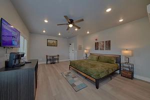 a bedroom with a bed and a flat screen tv at #6 Studio Town Place 2 in Sevierville