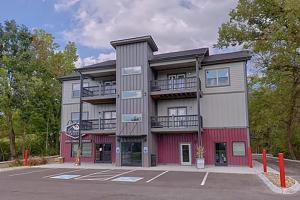 a large building with a parking lot in front of it at #6 Studio Town Place 2 in Sevierville +9 photos