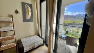 a room with a view of a balcony with a window at Beachfront Studio at Zantamar in Cruz de Huanacaxtle