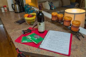 a bottle of wine sitting on top of a counter at The Place Between The Lakes 4 Bedrooms 4 Beds in Old Hickory