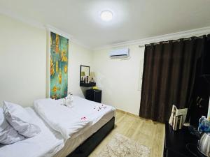 Voodi või voodid majutusasutuse Phoenix Pyramids View Inn toas