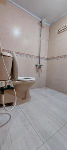 a bathroom with a toilet and a shower at Entire Ground Floor Elegance 3BR Gulistan e Joher Blk 14 Near Darul Sehat Hospital in Karachi +17 photos