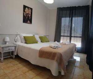 Postel nebo postele na pokoji v ubytování CASA PORTELA APARTAMENTOS