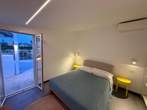 Postel nebo postele na pokoji v ubytování Buona Onda Apartments