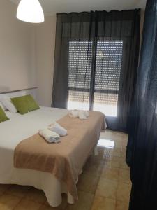 Postel nebo postele na pokoji v ubytování CASA PORTELA APARTAMENTOS
