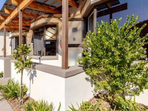 a house with a window on the side of it at Amalfi Place in Pretoria