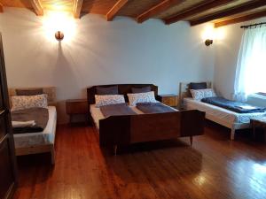 a living room with two beds and a couch at Happy Brook Bled in Bled