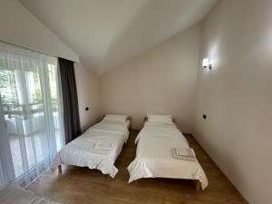 Postel nebo postele na pokoji v ubytování Jon Private Vila