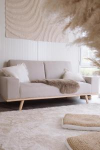 a white couch sitting in a living room at RetreatBoat Ibiza in Lith
