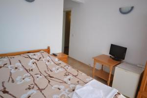 Ένα ή περισσότερα κρεβάτια σε δωμάτιο στο Guest House Olimpia