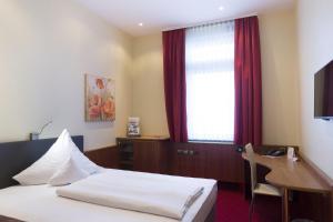 Postel nebo postele na pokoji v ubytování TOP Hotel Amberger