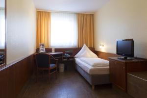 Postel nebo postele na pokoji v ubytování TOP Hotel Amberger