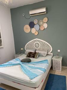 Postel nebo postele na pokoji v ubytování Studio de charme ⵣ