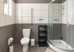 a bathroom with a toilet and a shower at Babel Hostel, Dworzec PKP, Rynek in Wrocław +39 photos