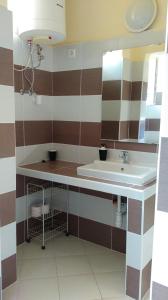 Phòng tắm tại Regina Vendégház Miskolc