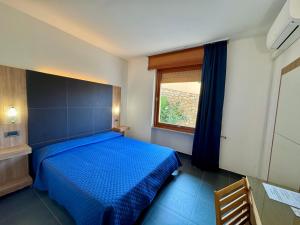 Ein Bett oder Betten in einem Zimmer der Unterkunft Hotel Fontalleccio