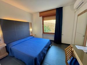 Postel nebo postele na pokoji v ubytování Hotel Fontalleccio