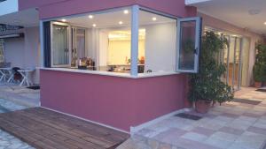 a building with a large window on the side of it at Katerina Lefkada in Vasiliki
