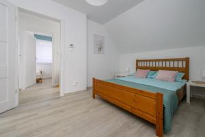 Postel nebo postele na pokoji v ubytování Domki Marina nad morzem