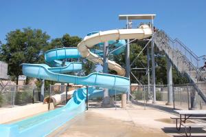 a blue water slide in a park at O'Connell's RV Campground Park Model 34 in Inlet