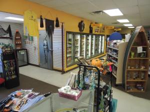 a room with a store with a bike on the wall at O'Connell's RV Campground Park Model 34 in Inlet