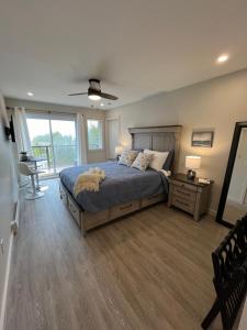 a bedroom with a bed and a large window at Tobermory Tides bed and breakfast in Tobermory