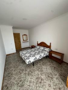 Ένα ή περισσότερα κρεβάτια σε δωμάτιο στο La Casa Rosada +1 φωτογραφίες