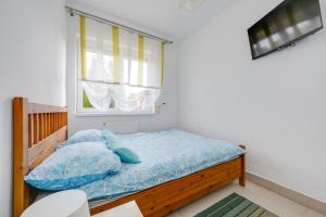 Postel nebo postele na pokoji v ubytování Marina- pokoje nad morzem