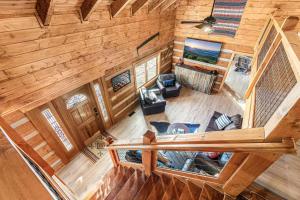 an overhead view of a living room in a log cabin at Smokies Getaway with Fire Pit Game Room & Hot Tub in Pigeon Forge
