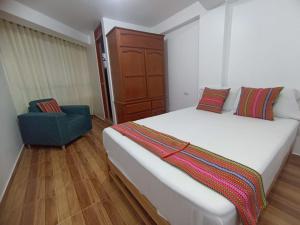 Ένα ή περισσότερα κρεβάτια σε δωμάτιο στο Habitaciones Cusco
