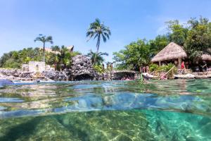 a view of the water at a resort at Coco Zen Studio king size bed sea view near Coco Beach PDC in Playa del Carmen