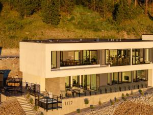 an aerial view of a large house with glass at Bialto Bed and Breakfast in Penticton
