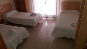 Postel nebo postele na pokoji v ubytování Hostal Jose Luis