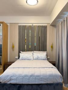 Postel nebo postele na pokoji v ubytování Casa Linnea - SMDC Cheer Residences + 37 fotografií