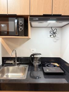 Kuchyň nebo kuchyňský kout v ubytování Casa Linnea - SMDC Cheer Residences