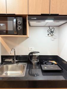 Kuchyň nebo kuchyňský kout v ubytování Casa Linnea - SMDC Cheer Residences
