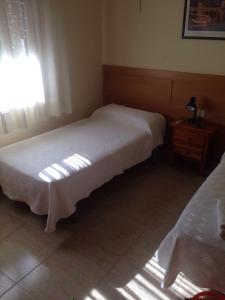 Postel nebo postele na pokoji v ubytování Hostal Jose Luis