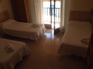 Postel nebo postele na pokoji v ubytování Hostal Jose Luis