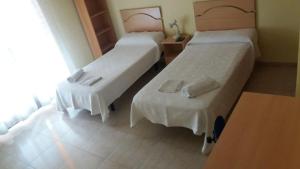 Postel nebo postele na pokoji v ubytování Hostal Jose Luis