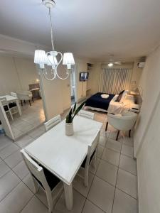 a living room with a table and a couch at ApartSur Santa Fe in Santa Fe