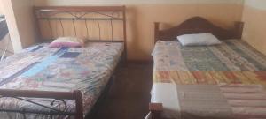 Ένα ή περισσότερα κρεβάτια σε δωμάτιο στο Don Bosco Home Stay