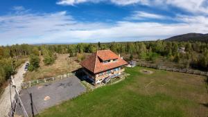 an aerial view of a house in a field at La poale de munte in Vistisoara