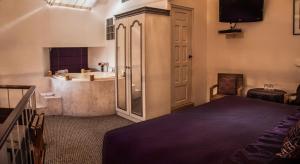 A bed or beds in a room at Andean Wings Boutique Hotel