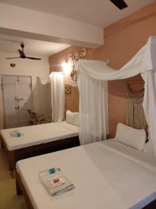 Postel nebo postele na pokoji v ubytování Vanam Pool Stay